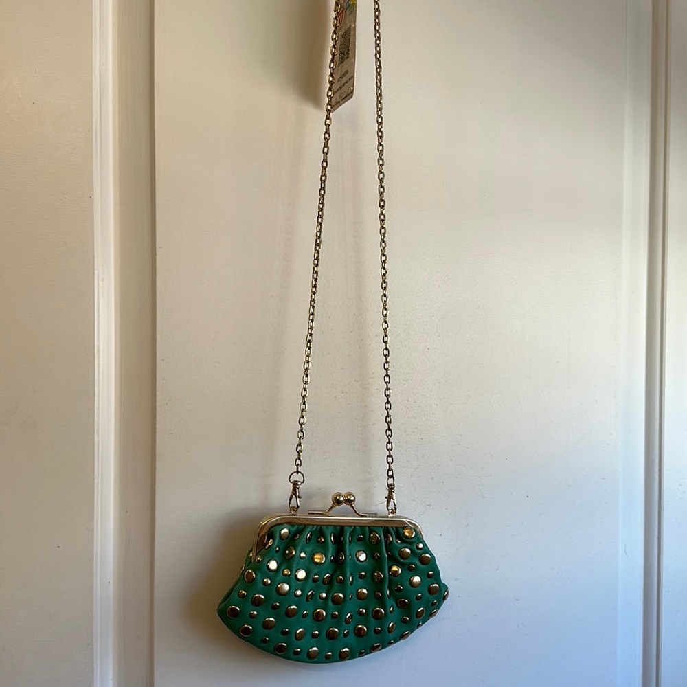 Cute clutch/ shoulder bag in brand new condition with tag in green color